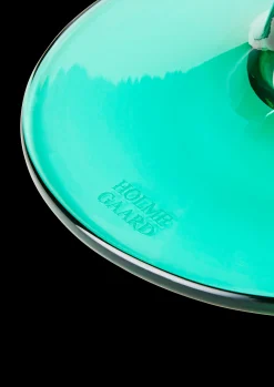 Holmegaard Flow Glas på fod 35 cl emerald green | Køb her